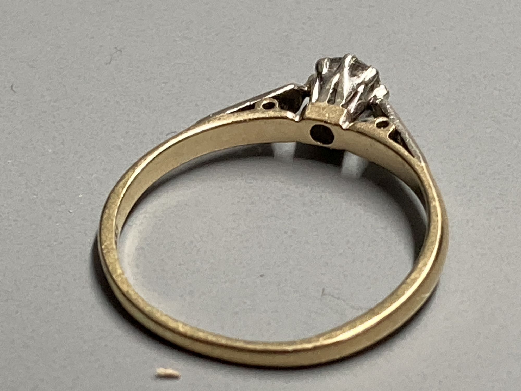 An 14ct gold and solitaire diamond ring, size L, gross 1.8 grams.